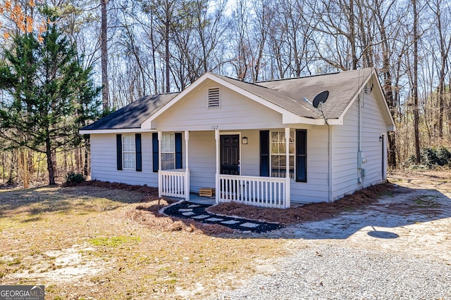 view of front of property with driveway and a porch