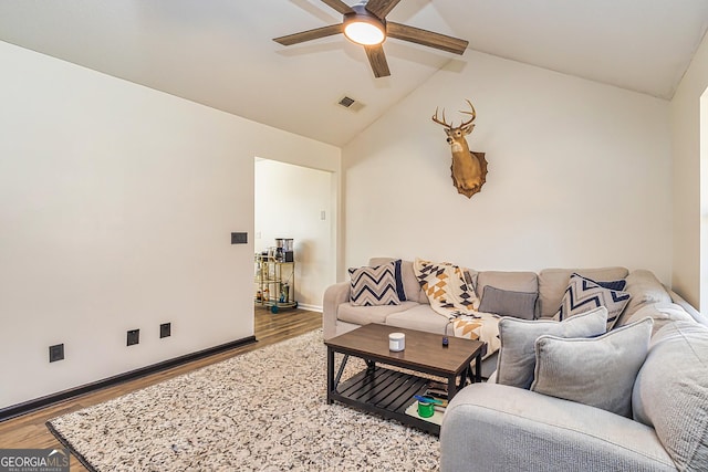 living area featuring lofted ceiling, visible vents, light wood-style floors, ceiling fan, and baseboards