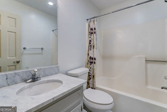 bathroom featuring toilet, shower / tub combo with curtain, and vanity