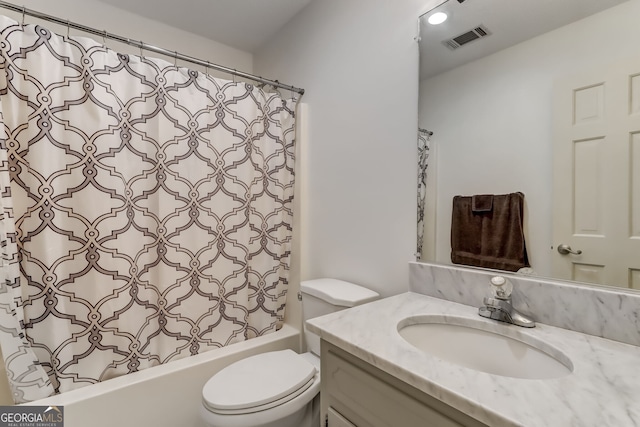 bathroom with toilet, shower / tub combo, vanity, and visible vents