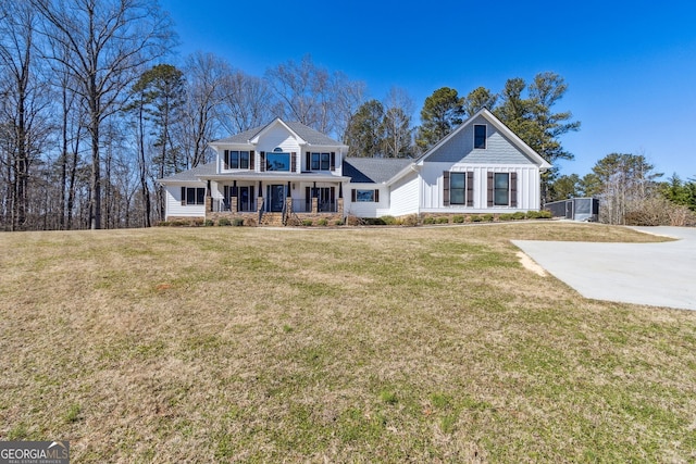 view of front of house with covered porch and a front yard