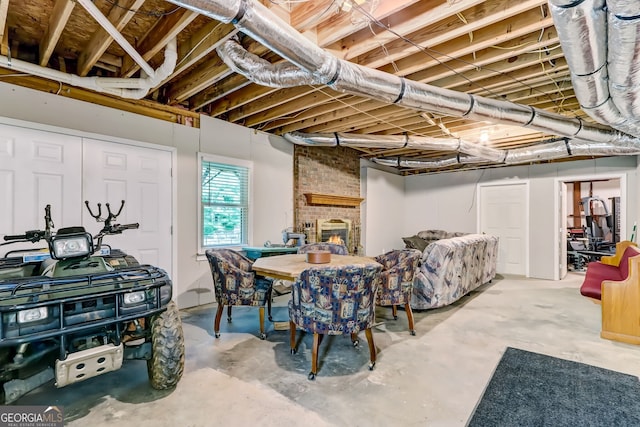 basement with a brick fireplace