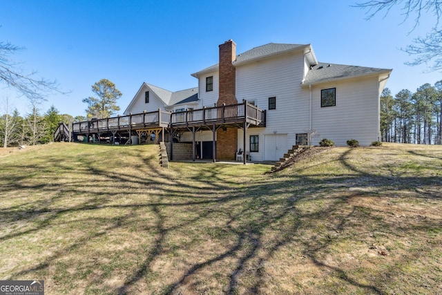 rear view of house with a deck, stairway, a lawn, and a chimney