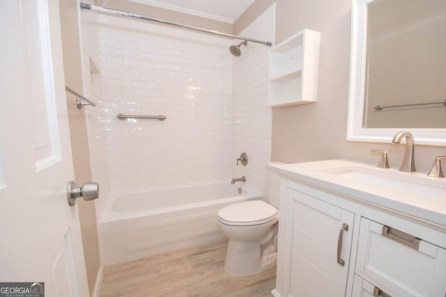 full bath featuring toilet, wood finished floors, vanity, shower / washtub combination, and crown molding