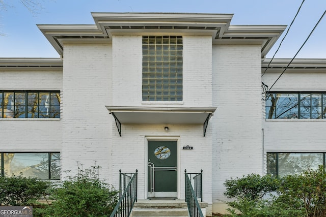 view of front of home featuring brick siding