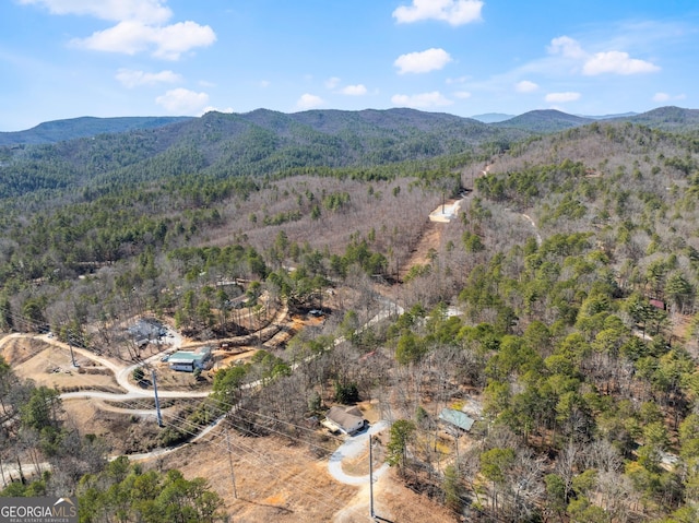 aerial view featuring a mountain view and a view of trees