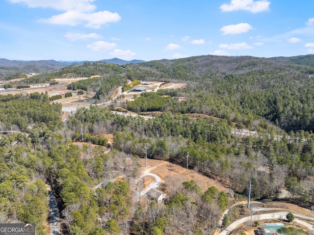 bird's eye view with a mountain view and a wooded view