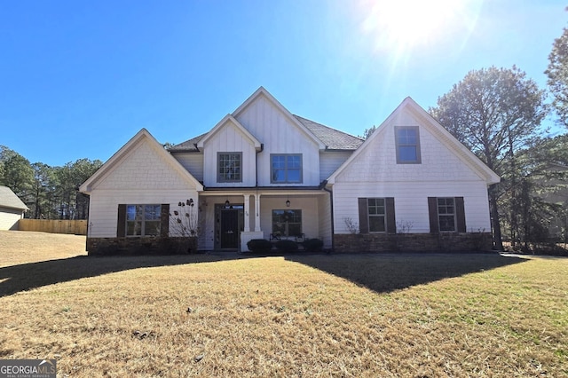 view of front of home featuring a front lawn and board and batten siding