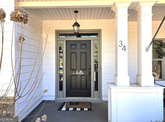 property entrance with covered porch