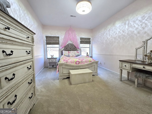 bedroom with carpet floors, visible vents, and baseboards