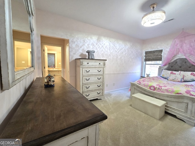 carpeted bedroom with visible vents and baseboards