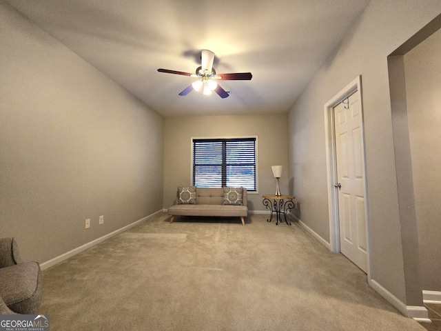 unfurnished room featuring ceiling fan, carpet flooring, and baseboards