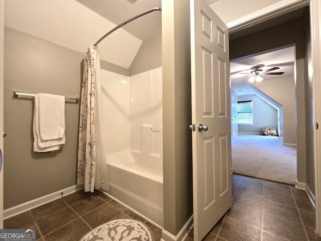 full bath with shower / tub combo, tile patterned flooring, baseboards, and vaulted ceiling