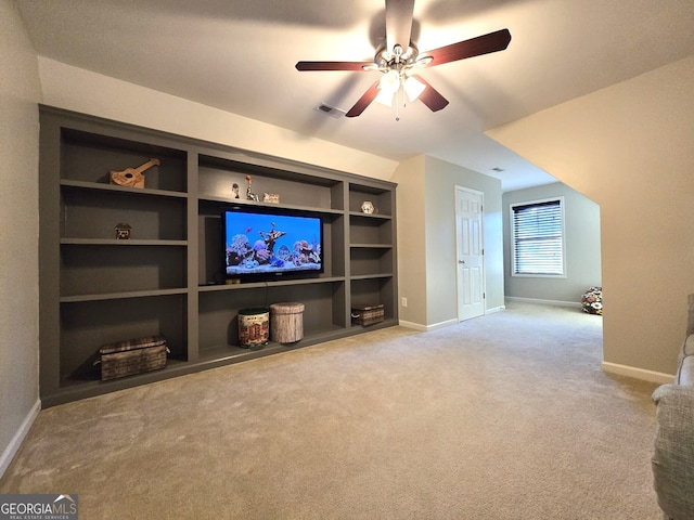 unfurnished living room featuring built in features, visible vents, carpet flooring, ceiling fan, and baseboards