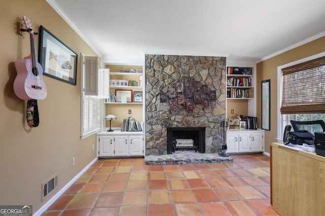 2484 Oldfield Rd NW, Atlanta, GA 30327 - living area featuring built in shelves, crown molding, light tile patterned floors, visible vents, and a stone fireplace