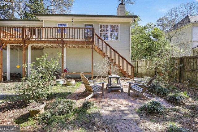 2484 Oldfield Rd NW, Atlanta, GA 30327 - back of house featuring a patio area, a chimney, stairs, and fence