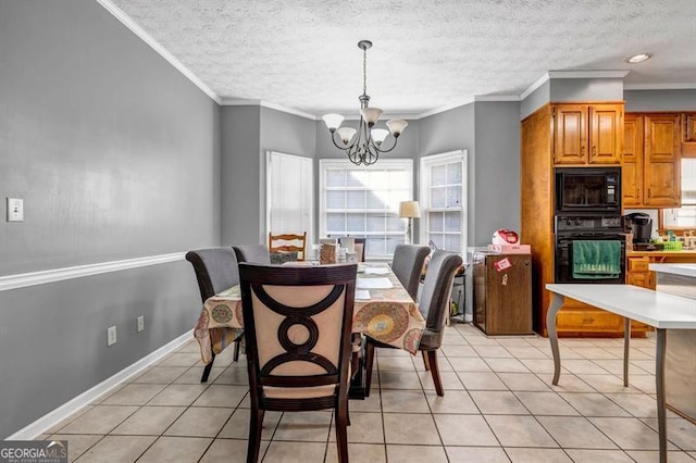 dining area with light tile patterned floors, ornamental molding, baseboards, and a notable chandelier