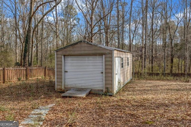 garage with fence