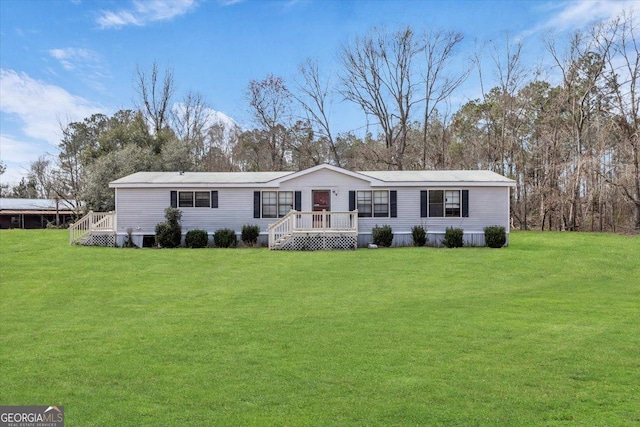 manufactured / mobile home with a front lawn