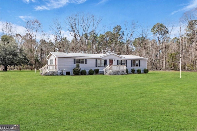 manufactured / mobile home with a front yard