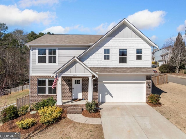 view of front of home featuring driveway, brick siding, board and batten siding, and fence