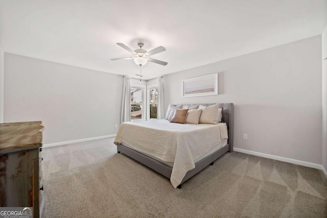 bedroom featuring carpet, baseboards, and ceiling fan