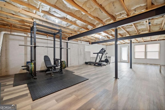 exercise room with wood finished floors