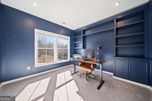 office space with visible vents, baseboards, carpet flooring, built in shelves, and recessed lighting