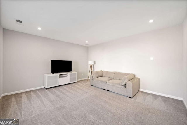 unfurnished living room with recessed lighting, visible vents, baseboards, and light colored carpet