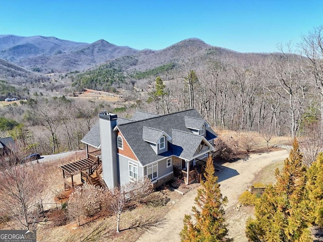 birds eye view of property featuring a mountain view