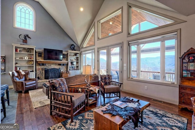 537 Mill Ridge Rd, Hiawassee, GA 30546 - living room featuring a wealth of natural light, visible vents, and a fireplace
