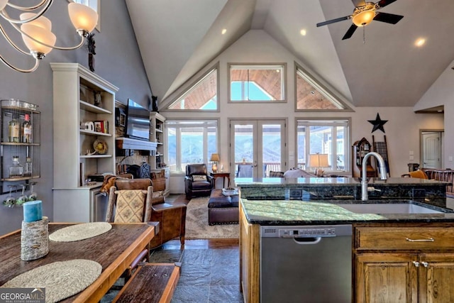 537 Mill Ridge Rd, Hiawassee, GA 30546 - kitchen featuring dishwasher, brown cabinets, open floor plan, a fireplace, and a sink