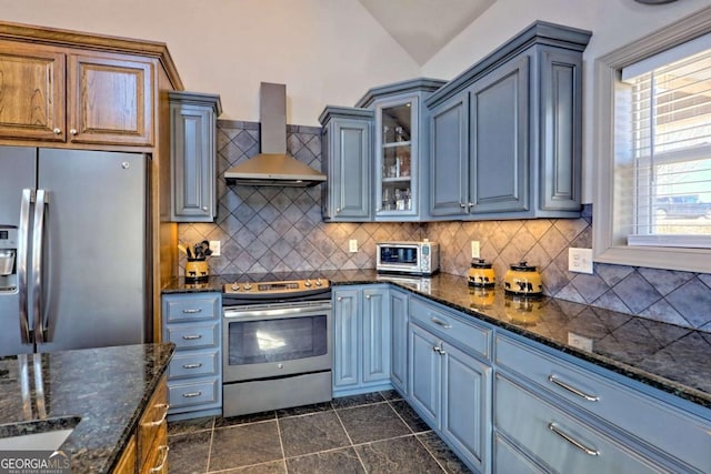 537 Mill Ridge Rd, Hiawassee, GA 30546 - kitchen featuring wall chimney range hood, glass insert cabinets, appliances with stainless steel finishes, and tasteful backsplash