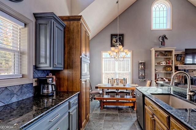 537 Mill Ridge Rd, Hiawassee, GA 30546 - kitchen featuring dark stone counters, appliances with stainless steel finishes, a sink, and pendant lighting