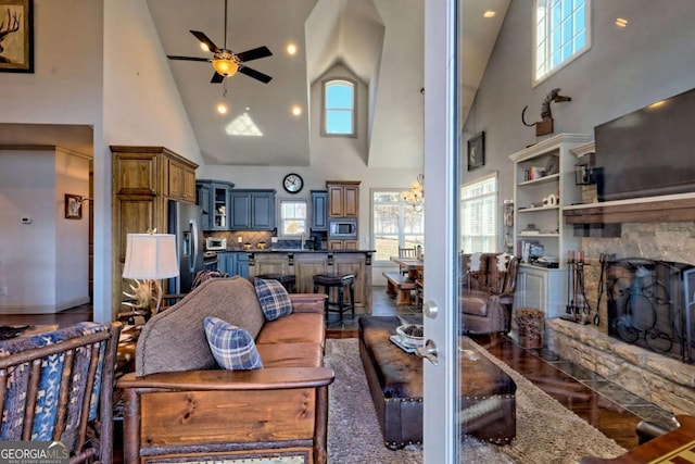 537 Mill Ridge Rd, Hiawassee, GA 30546 - living area featuring ceiling fan, dark wood-type flooring, a fireplace, and a healthy amount of sunlight