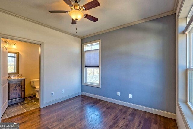 537 Mill Ridge Rd, Hiawassee, GA 30546 - unfurnished bedroom with dark wood-type flooring, connected bathroom, crown molding, and baseboards