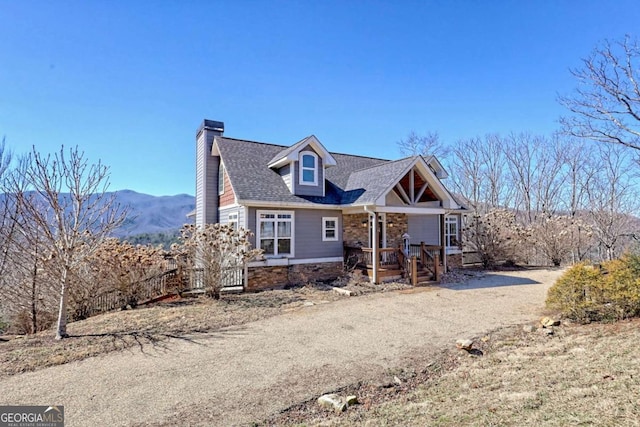 537 Mill Ridge Rd, Hiawassee, GA 30546 - view of front of home featuring roof with shingles, a porch, a chimney, and a mountain view