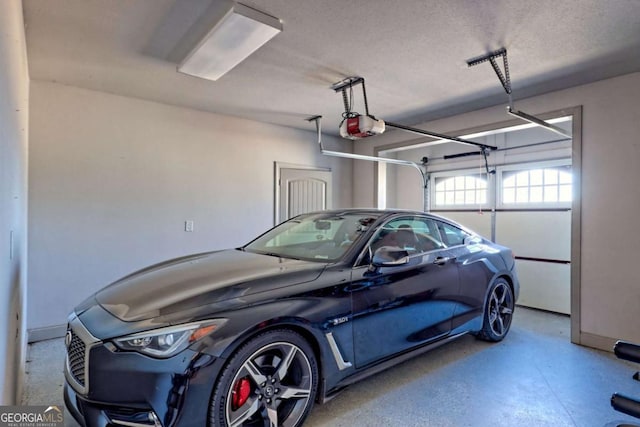 537 Mill Ridge Rd, Hiawassee, GA 30546 - garage featuring a garage door opener
