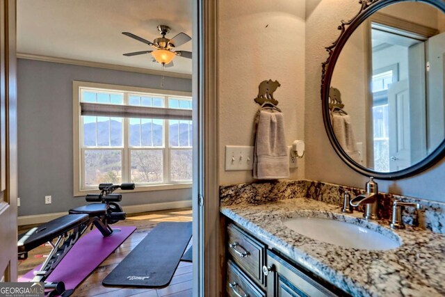 537 Mill Ridge Rd, Hiawassee, GA 30546 - bathroom with baseboards, a ceiling fan, vanity, and crown molding