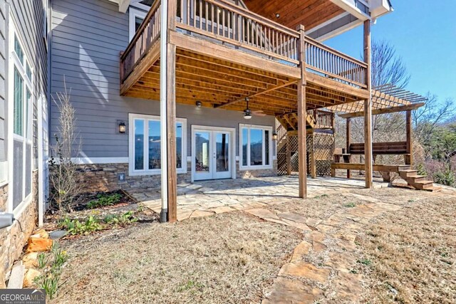537 Mill Ridge Rd, Hiawassee, GA 30546 - back of house with french doors, a patio area, stone siding, a wooden deck, and stairs