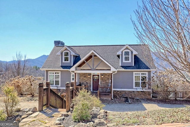 537 Mill Ridge Rd, Hiawassee, GA 30546 - view of front of house featuring stone siding, a porch, a shingled roof, and a mountain view