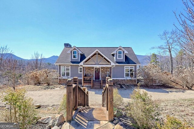 537 Mill Ridge Rd, Hiawassee, GA 30546 - view of front facade with a fenced front yard and a mountain view