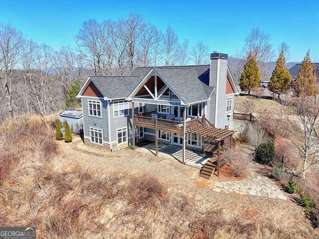 537 Mill Ridge Rd, Hiawassee, GA 30546 - rear view of property featuring a chimney, dirt driveway, a patio area, a deck, and stairs