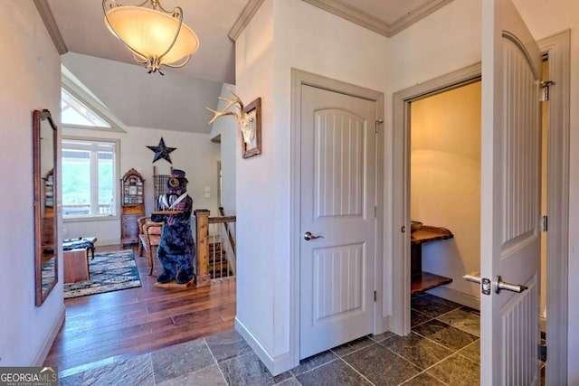 537 Mill Ridge Rd, Hiawassee, GA 30546 - hall featuring vaulted ceiling, ornamental molding, stone tile flooring, and baseboards