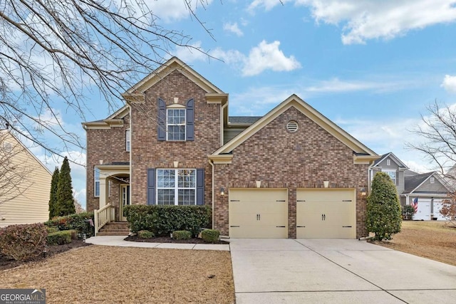 traditional home featuring concrete driveway, brick siding, and an attached garage