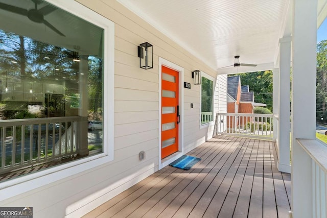 wooden deck featuring ceiling fan