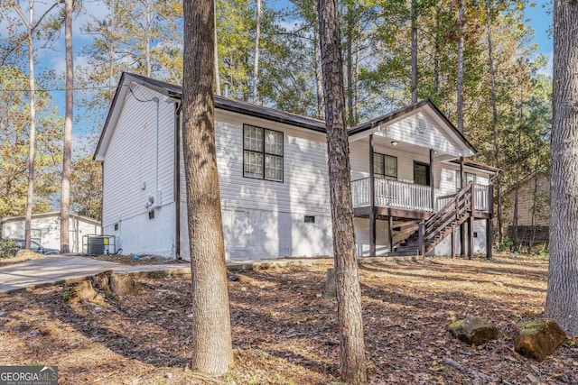 7155 Pineneedle Dr SW, Covington, GA 30016 - exterior space featuring crawl space, central AC, and stairway
