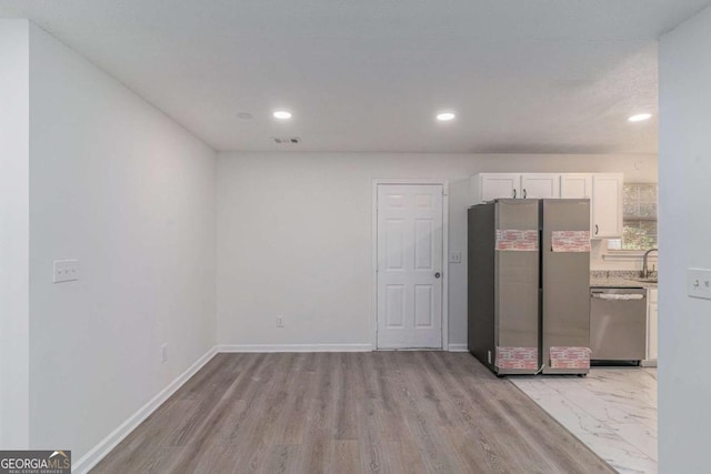 kitchen featuring visible vents, white cabinets, baseboards, appliances with stainless steel finishes, and recessed lighting