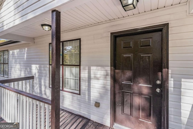 doorway to property featuring covered porch