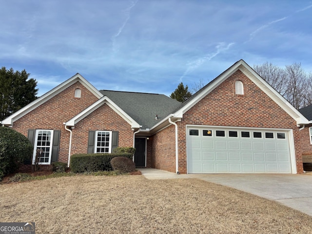 ranch-style home with concrete driveway, brick siding, and an attached garage